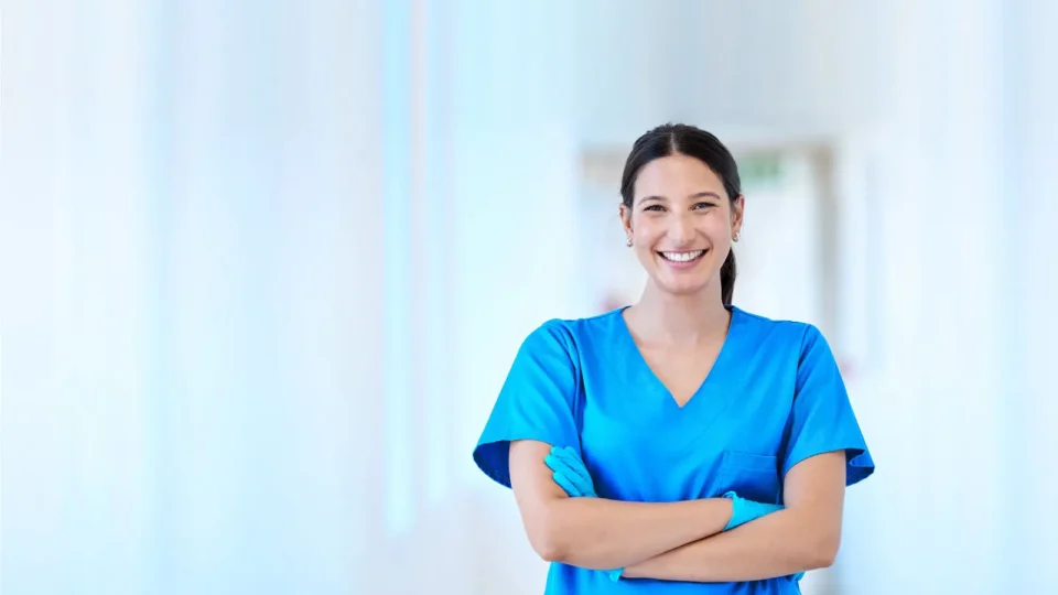 hero-smiling female dentist standing